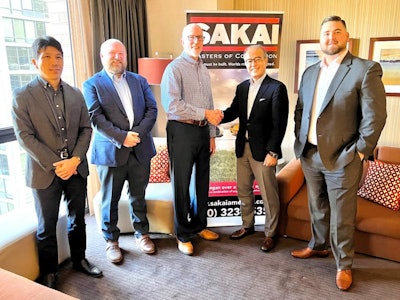 Executives from Sakai and Taylor Construction Equipment