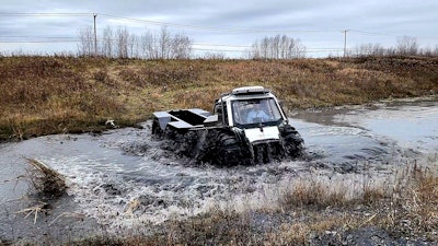 Fat Truck 8x8 amphibious vehicle crossing a river