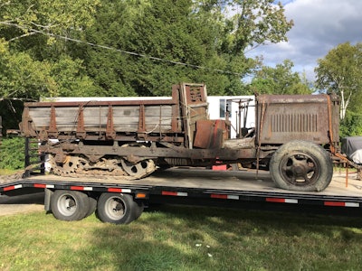 rusty 1935 Linn tractor on trailer