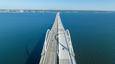 aerial view of new Pensacola Bay Bridge arches over blue water