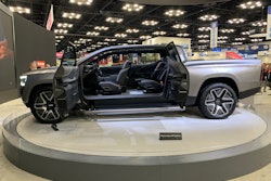 silver electric Ram REV 1500 pickup truck on trade show display