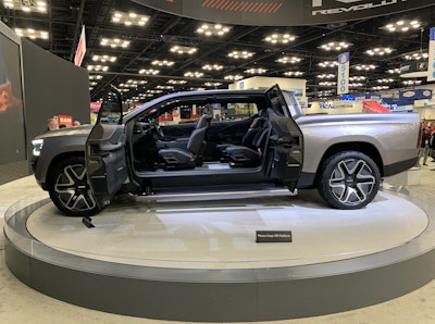 silver electric Ram REV 1500 pickup truck on trade show display