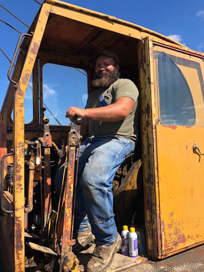 George Marsh in operator seat of 1956 Lorain TL-25 crawler crane with Scoop Shovel