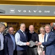 Volvo CE executives hand over the key to the first fossil-free haul truck at CONEXPO