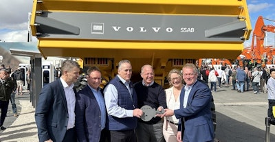 Volvo CE executives hand over the key to the first fossil-free haul truck at CONEXPO