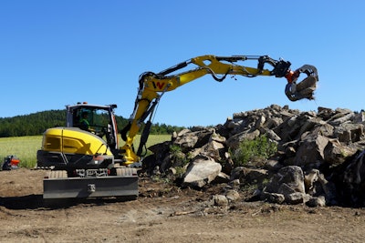 EW100 grappling a rock