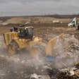 Cat 836 Landfill Compactor pushing debris