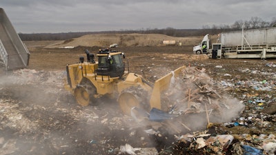 Cat 836 Landfill Compactor pushing debris