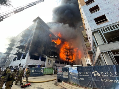 fire comes out of apartment building under construction in Charlotte