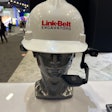 silver dummy head wearing white Link-Belt Excavators hardhat and Realwear augmented-reality headset