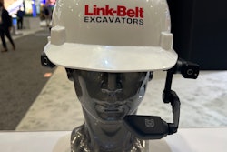 silver dummy head wearing white Link-Belt Excavators hardhat and Realwear augmented-reality headset