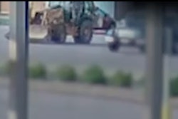 surveillance video screenshot of video posted on Williamson County Sheriff's Office Facebook page of man driving stolen backhoe to airport