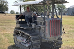 Tom pfeiffer sitting in restored 1929 Caterpillar Thirty crawler tractor