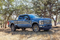 2023 Ford Super Duty F350 Limited bluish gray side view oak trees in background