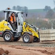 Wacker Neuson WL28 wheel loader carrying a pallet