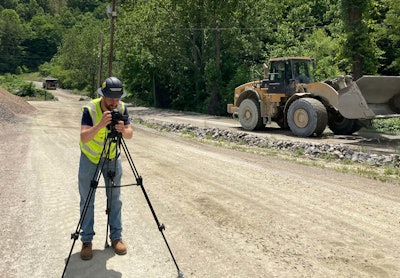 Seth Fargher taking photos on a construction site