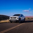 Chevy Silverado EV work truck driving down desert highway