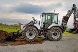 Huddig 1370T hybrid backhoe digging with front loader bucket