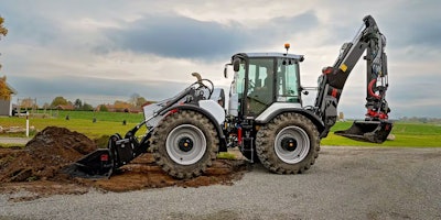 Huddig 1370T hybrid backhoe digging with front loader bucket