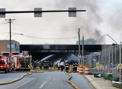 firefighters battle fire under collapsed I95 section Philadelphia