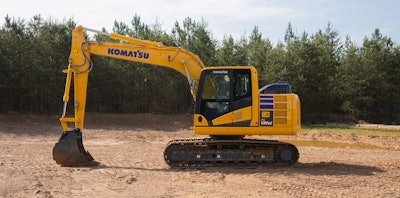 Komatsu PC130LC-11 excavator in dirt field