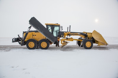 Side view Sany SMG200AWD motor grader in snow