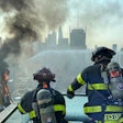 Firefighters work to put out a fire after a crane collapse in new york city