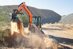 develon DX42-7 compact excavator dumping dirt