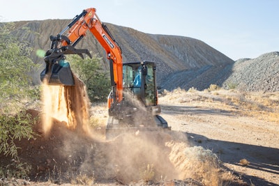 develon DX42-7 compact excavator dumping dirt