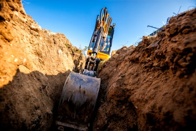 excavator digging trench