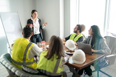 Construction workers in a conference room