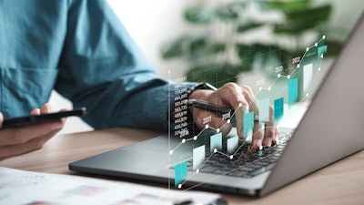 man analyzing data at a computer