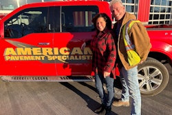 Colleen and Bill Stanley stand beside red American Pavement Specialist pickup truck