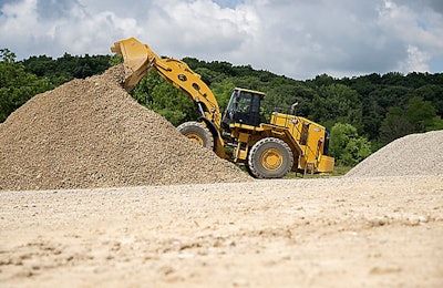 Cat 988 GC wheel loader on gravel pile dumping load
