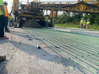 concrete sensors placed under rebar on road project about to be covered by concrete paver