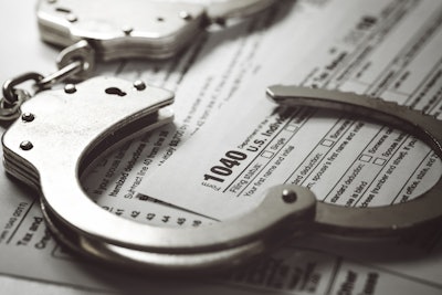 handcuffs on top of 1040 tax form
