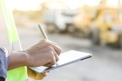 construction worker using a tablet