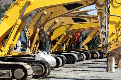 Excavators in a row