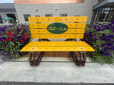 Bench made from old construction equipment parts.