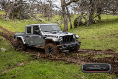 2023 Jeep Gladiator Rubicon FarOut diesel ripping through wooded area in mud