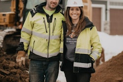 Missy & Trevor Scherber owners of T Scherber Demolition & Excavating on jobsite in front of excavator