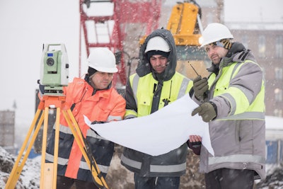 Construction workers on a jobsite in the winter