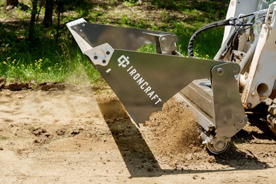 IronCraft 4N1 Power Rake on skid steer pushing dirt