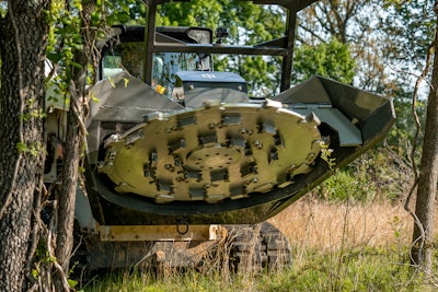 underside of IronCraft Forestry Disc Mulcher on compact track loader