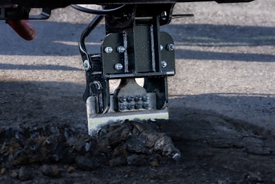 JCB Pothole Pro cropping tool cutting into road