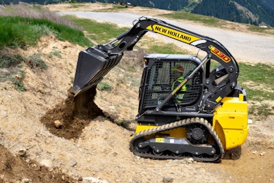 New Holland C330 compact track loader dumping dirt