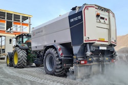 Streumaster SW112 TC binding agent spreader being pulled by tractor