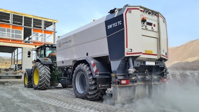 Streumaster SW112 TC binding agent spreader being pulled by tractor