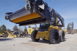 Werk-Brau pickup dump broom raised on skid steer