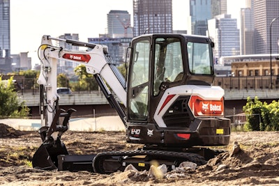 bobcat e40 compact excavator on dirt beside bridge